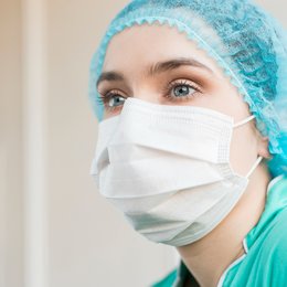 Image low-angle-nurse-with-mask-at-hospital from Freepik