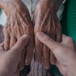 Image young-woman-holding-an-elderly from Freepi