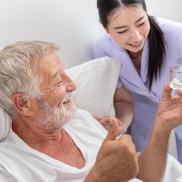 Image happy-nurse-give-pills-assist-and-encourage-elderly from Freepik.